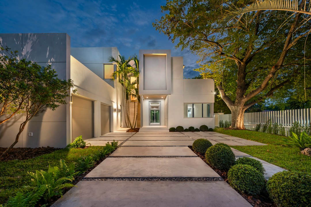 Contemporary white home at dusk
