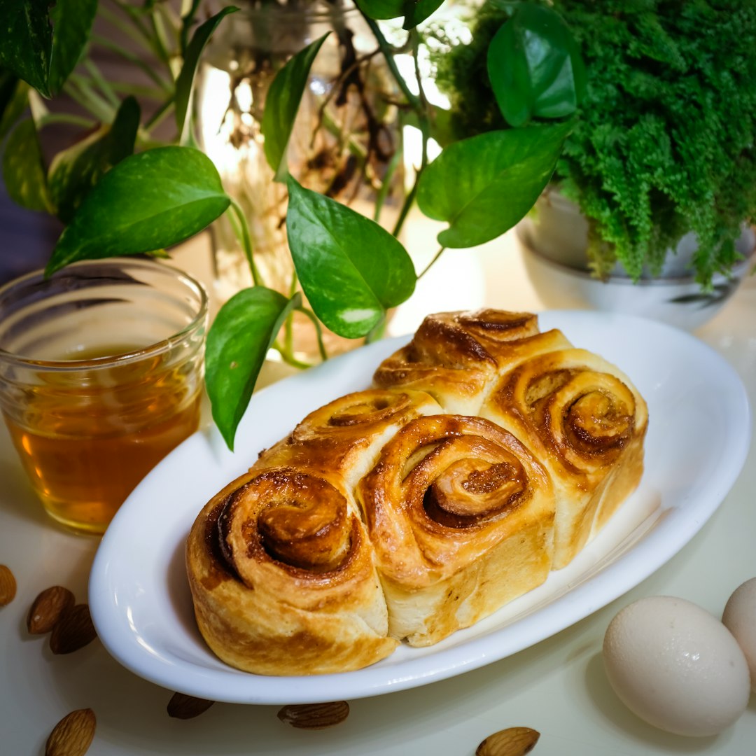 Cardamom pastry served beside a cup of tea