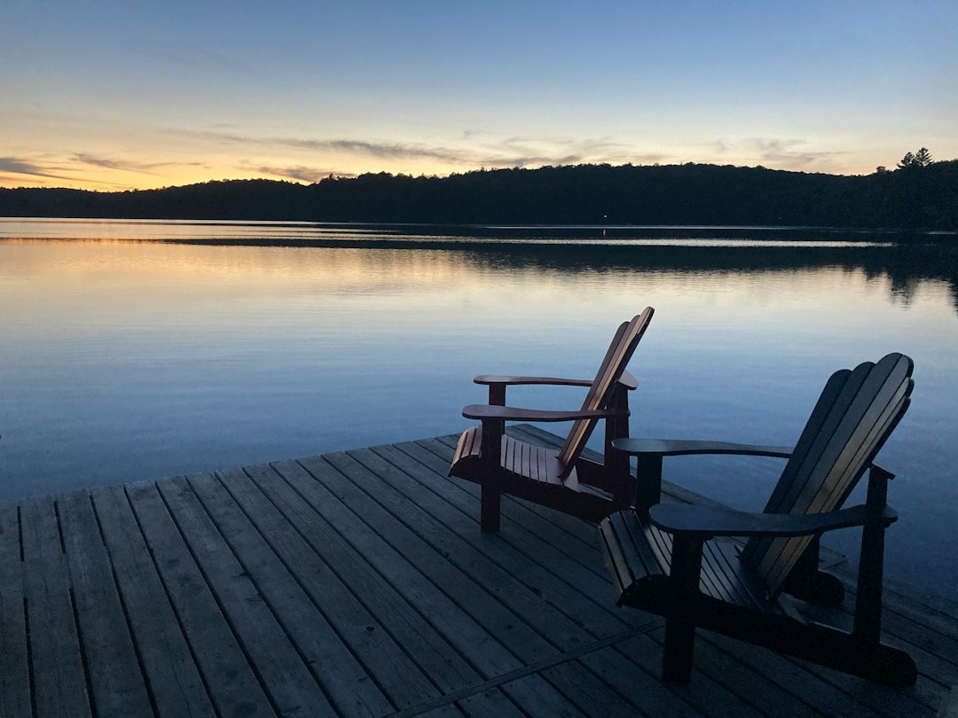 Quiet lake and dock at sunrise