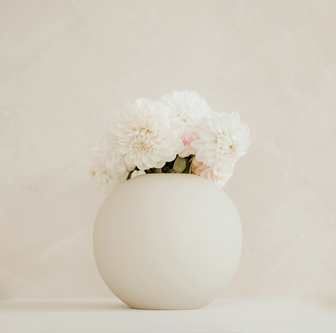 White floral arrangement in a white vase
