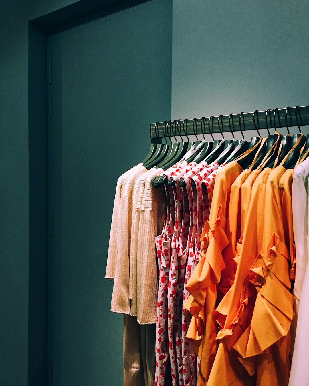 Colorful clothing on a boutique rack