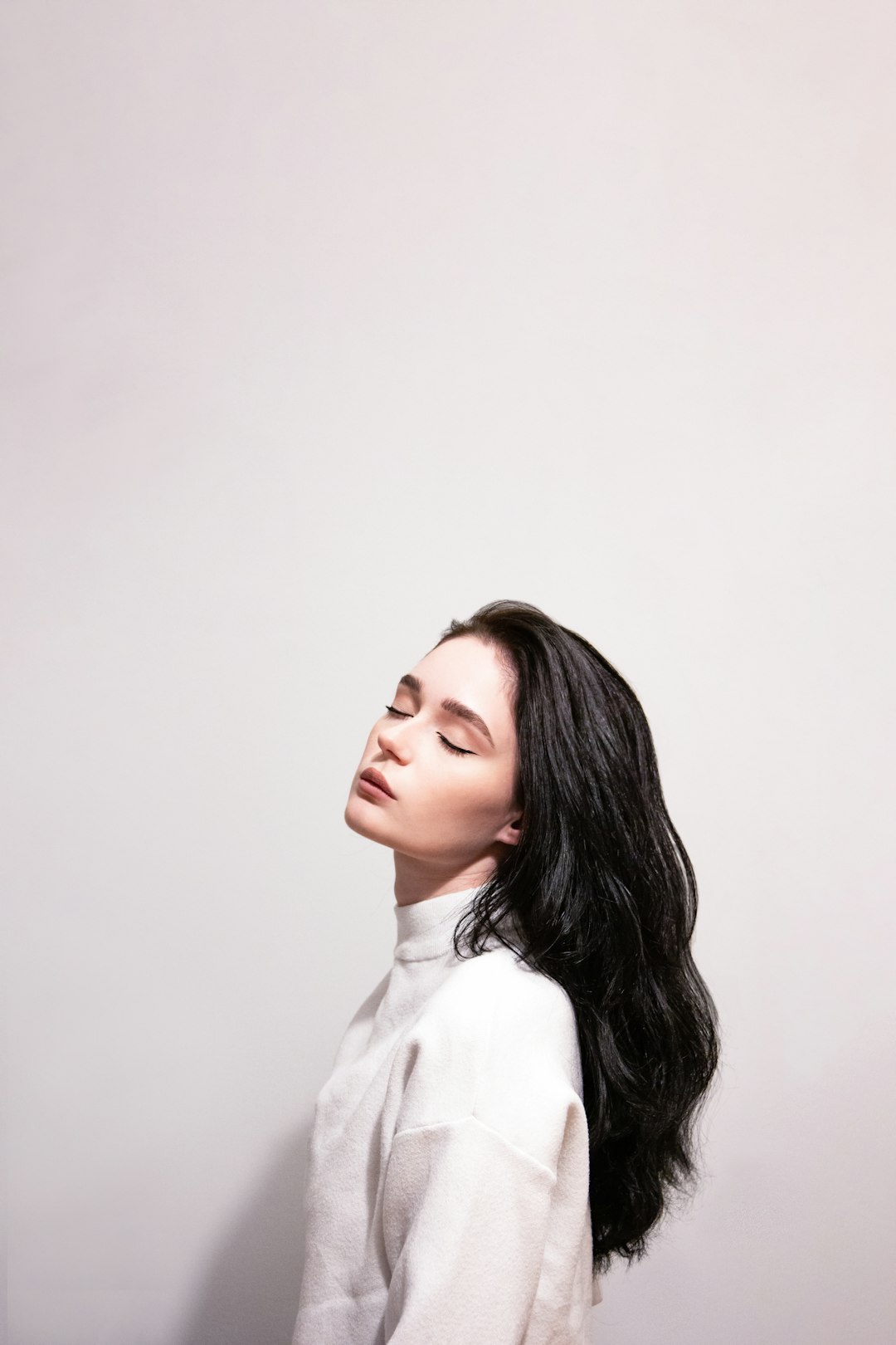 Editorial portrait with long dark hair; stock inspiration