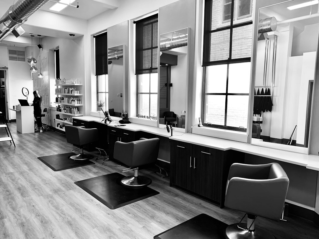 Black-and-white salon interior with styling stations