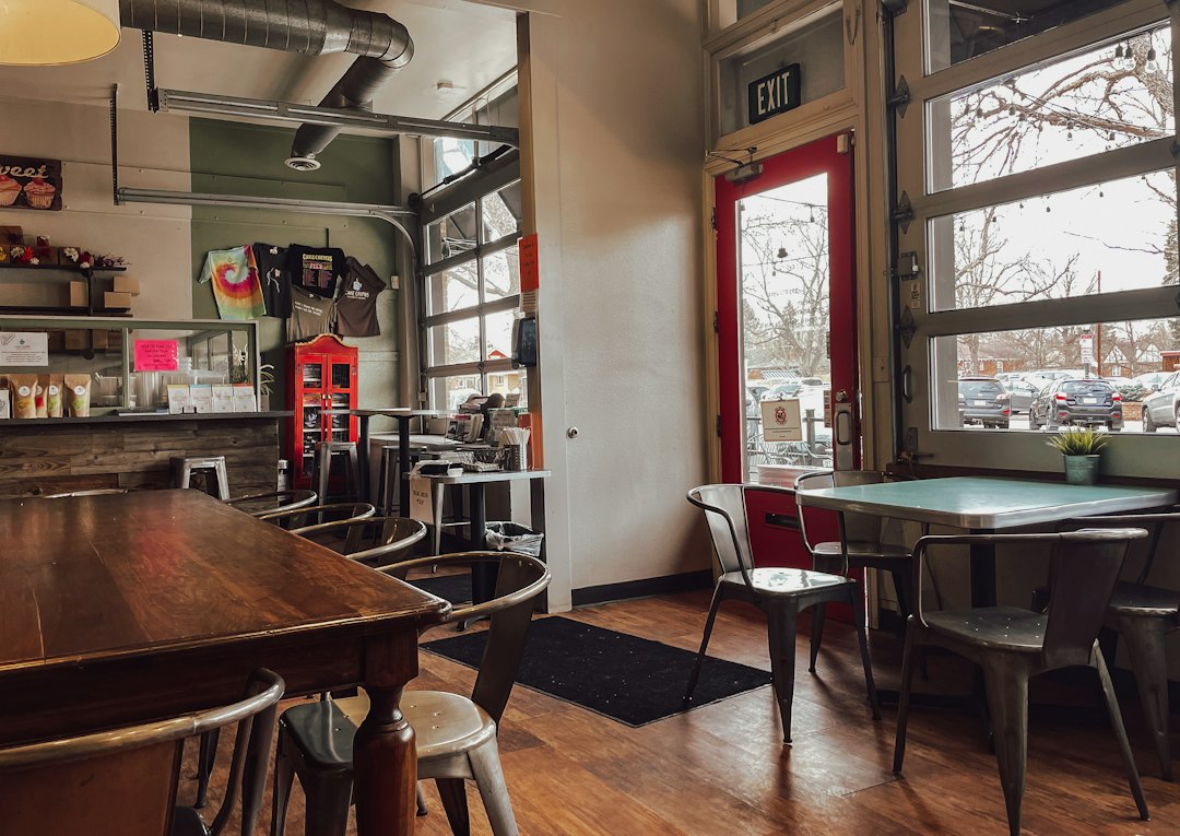 Warm neighborhood coffee shop interior with wood furnishings