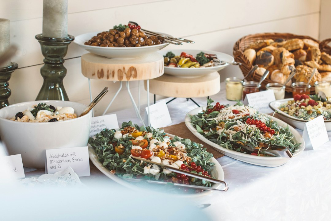 Mediterranean catering spread with assorted plates