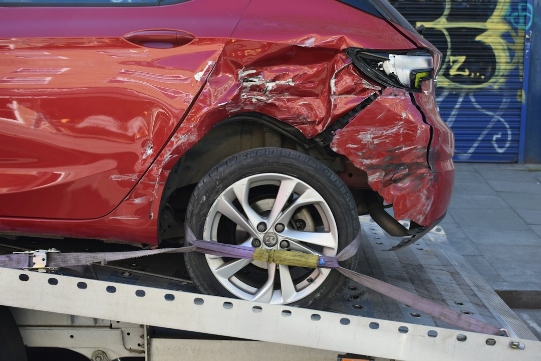 Collision-damaged vehicle being recovered after an accident