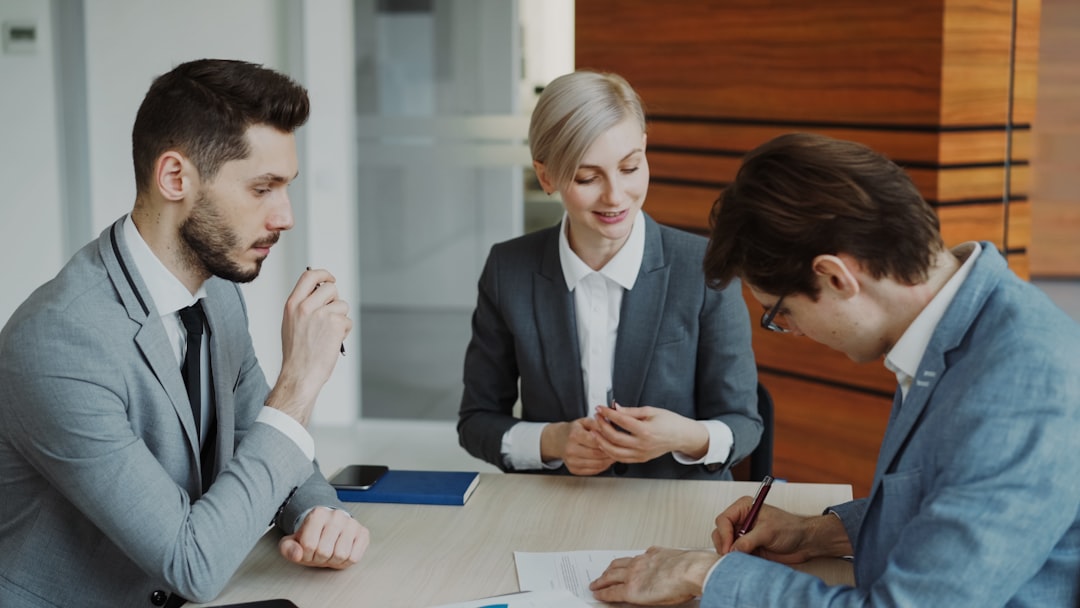 Professionals reviewing a contract in an office